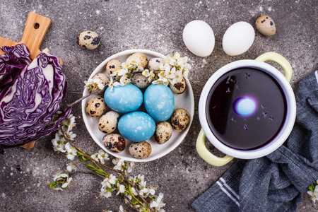 Process of painting Easter eggs in blueの写真素材