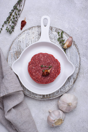 Raw uncooked spicy beefsteaks cutletの写真素材