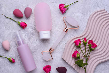 Rose quartz roller and cosmetic tubesの写真素材