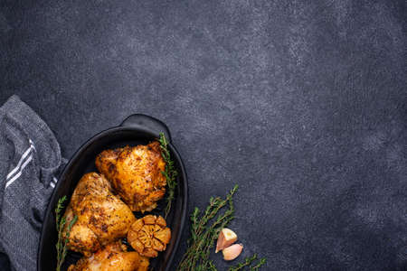 Grilled chicken thighs with garlicの写真素材