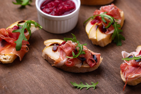 Toasts with pear and prosciutto