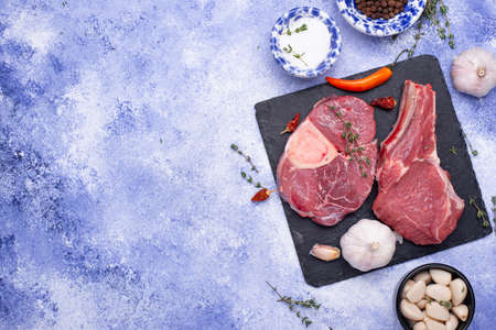 Raw uncooked ossobucco steak with spicesの写真素材