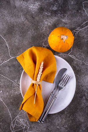 Table setting on grey concrete backgroundの写真素材
