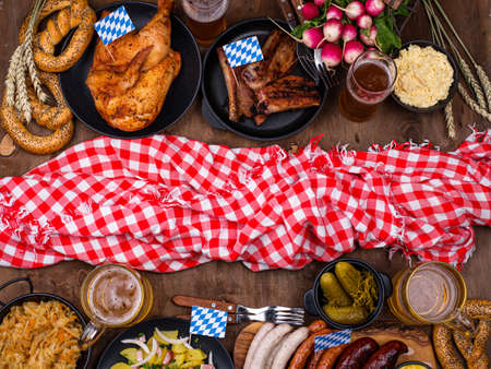 Oktoberfest dishes with beer, pretzel and sausageの写真素材