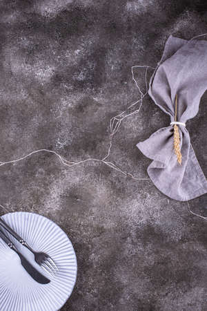 Table setting on grey concrete backgroundの写真素材