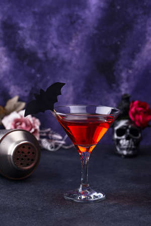 Halloween martini cocktail on purple backgroundの写真素材