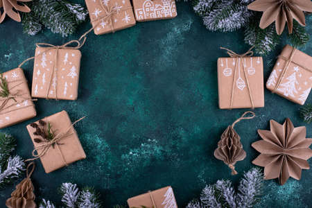 Christmas gift boxes in craft paperの写真素材