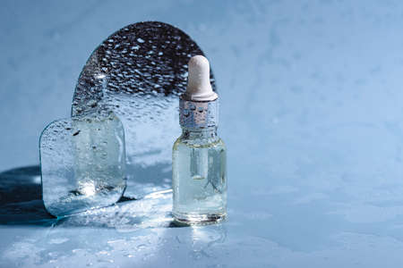 Bottle with serum or hyaluronic with waterの写真素材