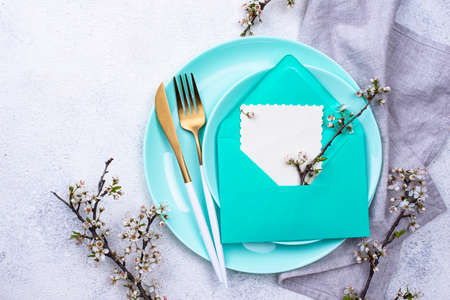 Spring table setting with envelopeの写真素材