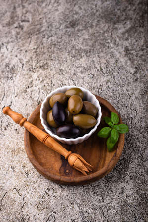 Bowl with Greek green and black olivesの写真素材