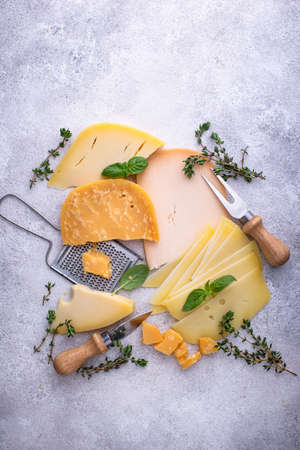 Parmesan, cheddar, gouda and maasdam cheeseの写真素材