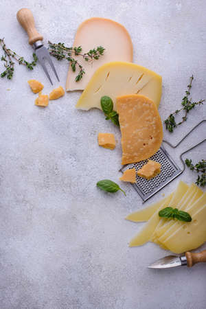 Parmesan, cheddar, gouda and maasdam cheeseの写真素材