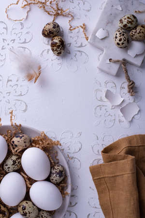 Bowl with chicken and quail raw eggs oの写真素材