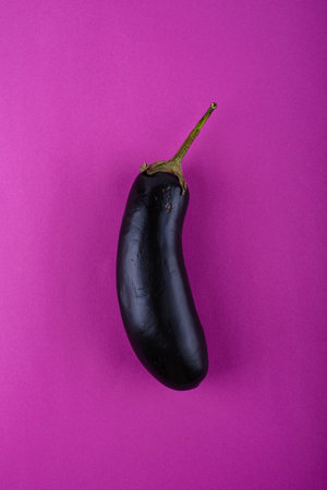 Eggplant on purple violet background.の写真素材