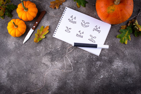 Notebook with scary face for making Halloween jack-o-lanternの写真素材