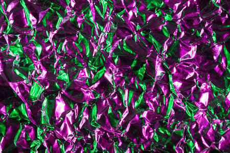 Abstract foil background with color lightの写真素材