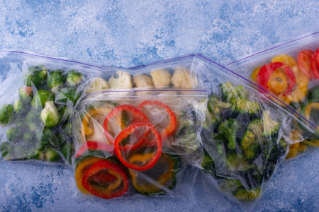 Different frozen vegetables. Food storage.