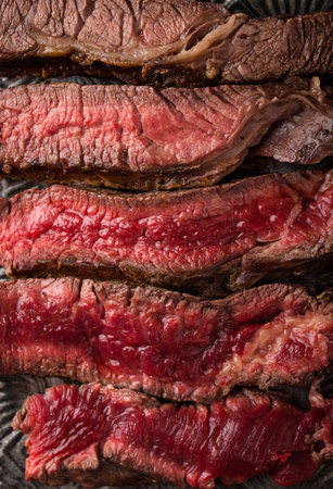 Different degrees of steak roasting. Steak with blood, medium to high roast steak on a wooden board