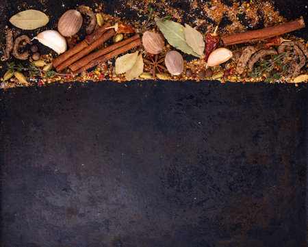 Different spices and herbs on a black backgroundの写真素材