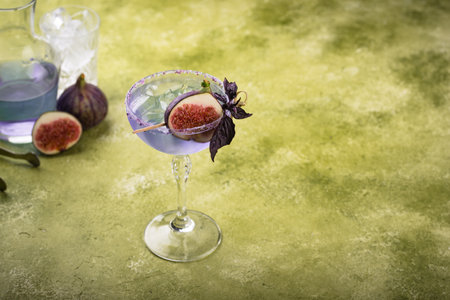 Purple fig cocktail or mocktail in glassの写真素材