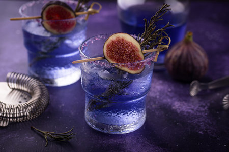 Purple fig cocktail or mocktail in glass