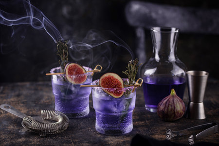 Purple fig cocktail or mocktail in glassの写真素材