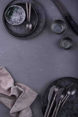 Craft iron tableware in grey backgroundの写真素材