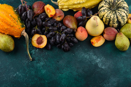 Assortment of autumn fruit. Pear, peach, grapes