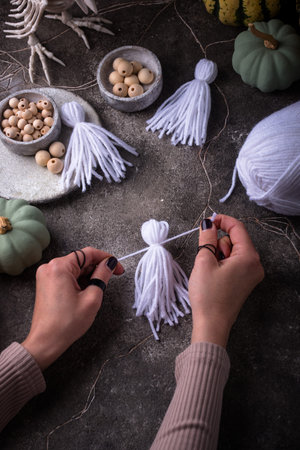 DIY craft Halloween garland in shape of ghost.