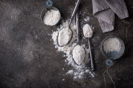 Wheat flour on dark. Baking backgroundの写真素材