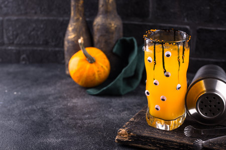 Spooky Halloween cocktail with eyesの写真素材