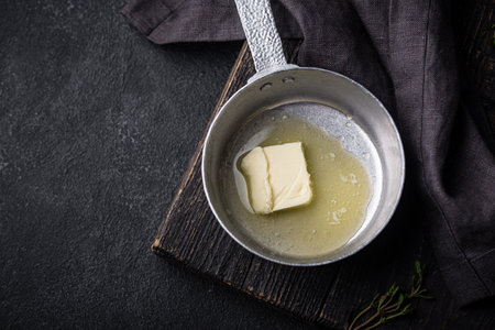 Melted butter on in iron panの写真素材