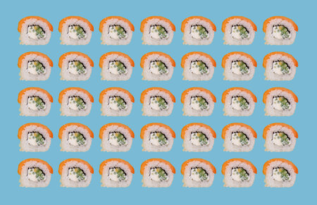 Colorful sushi rolls in repetitive patternの写真素材