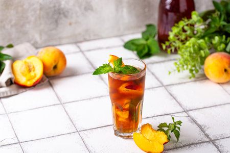 Cold ice tea with peach and mintの写真素材