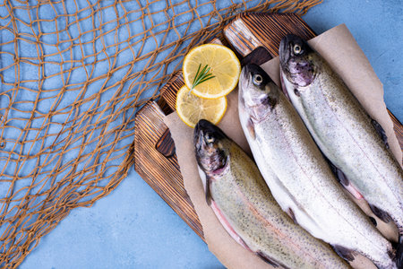 Raw uncooked trout with lemonの写真素材