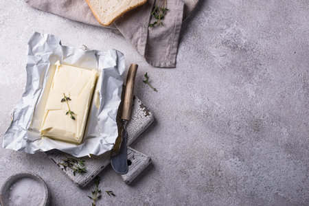 Fresh butter on grey backgrouns.