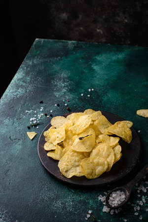 Crispy salty homemade potato chipsの写真素材