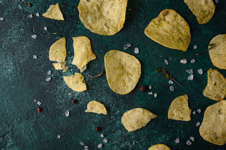 Crispy salty homemade potato chipsの写真素材