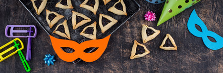 Jewish holiday Purim with carnival mask and cookies Hamantaschenの写真素材