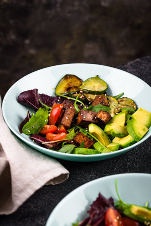 Healthy vegan keto salad with tofu and avocadoの写真素材