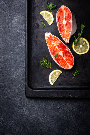 Raw uncooked salmon with rosemaryの写真素材
