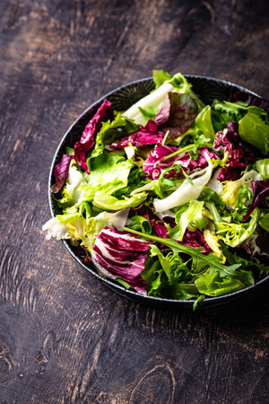 Bowl of fresh green salad mixの写真素材