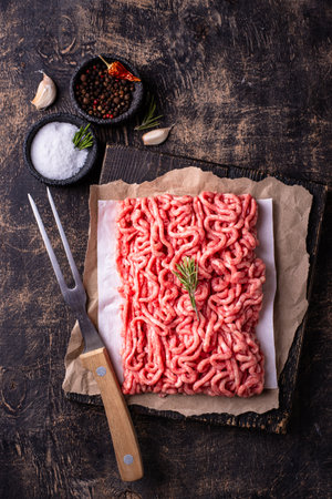 Raw minced meat on dark backgroundの写真素材