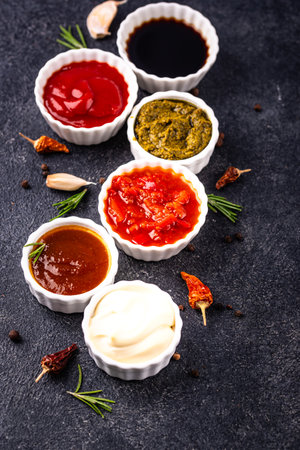 Set of different sauces. Ketchup, mustard, pestoの写真素材