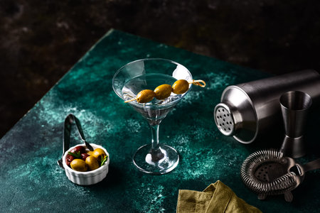 Traditional martini cocktail with olives and