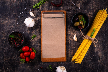 Italian food background with spaghetti, tomato and spicesの写真素材
