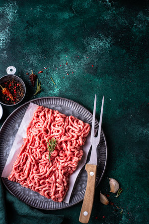 Raw minced meat on dark backgroundの写真素材