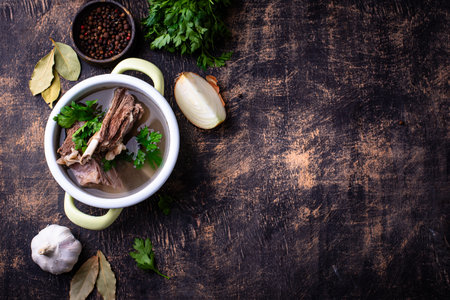 Boiled bone broth or bouillon with meatの写真素材