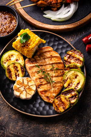 Assortment of grilled bbq meat and vegetablesの写真素材