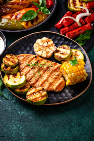 Assortment of grilled bbq meat and vegetablesの写真素材